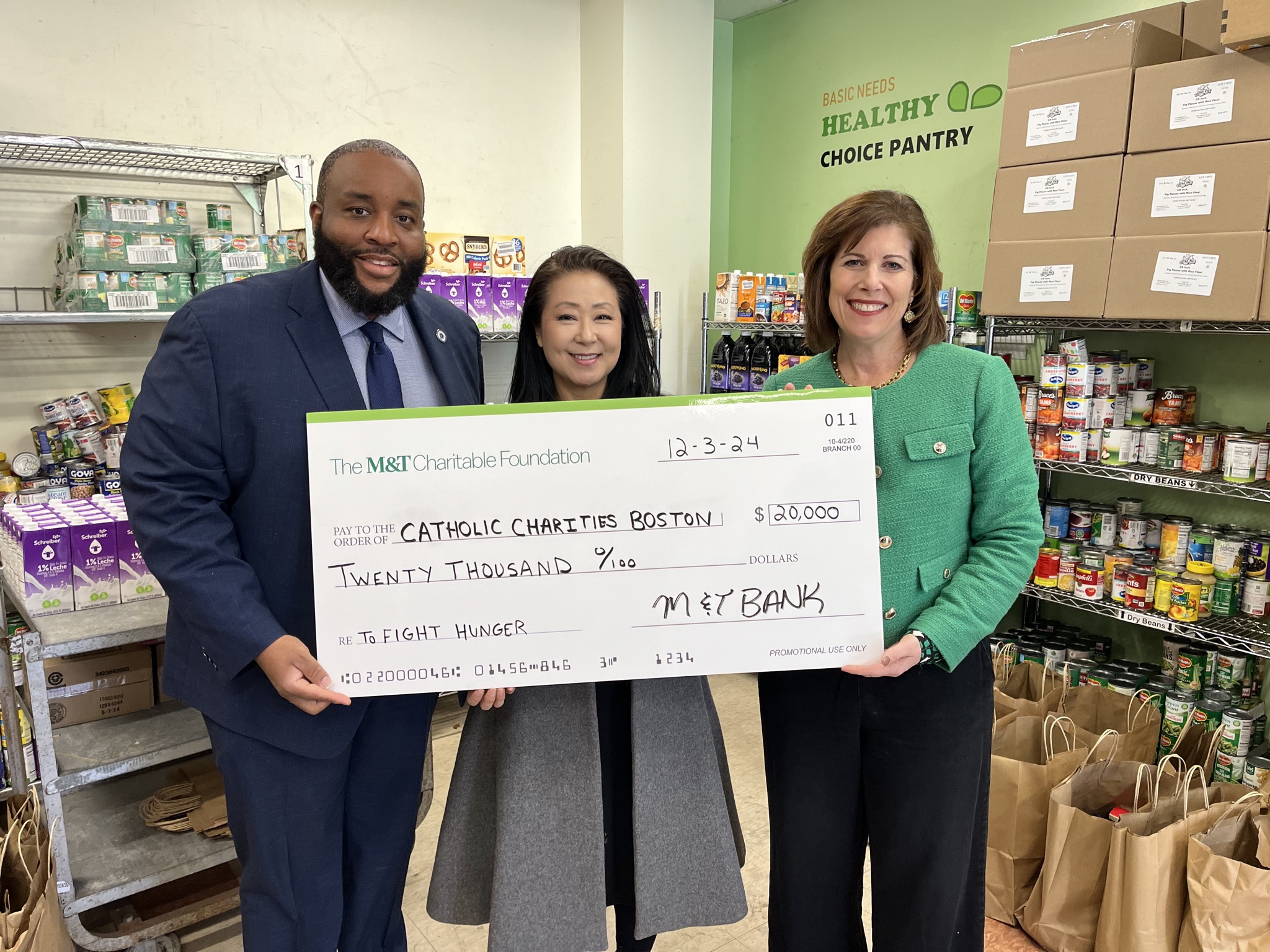 Chris Worrell presenting $20,000 check to Catholic Charities Boston