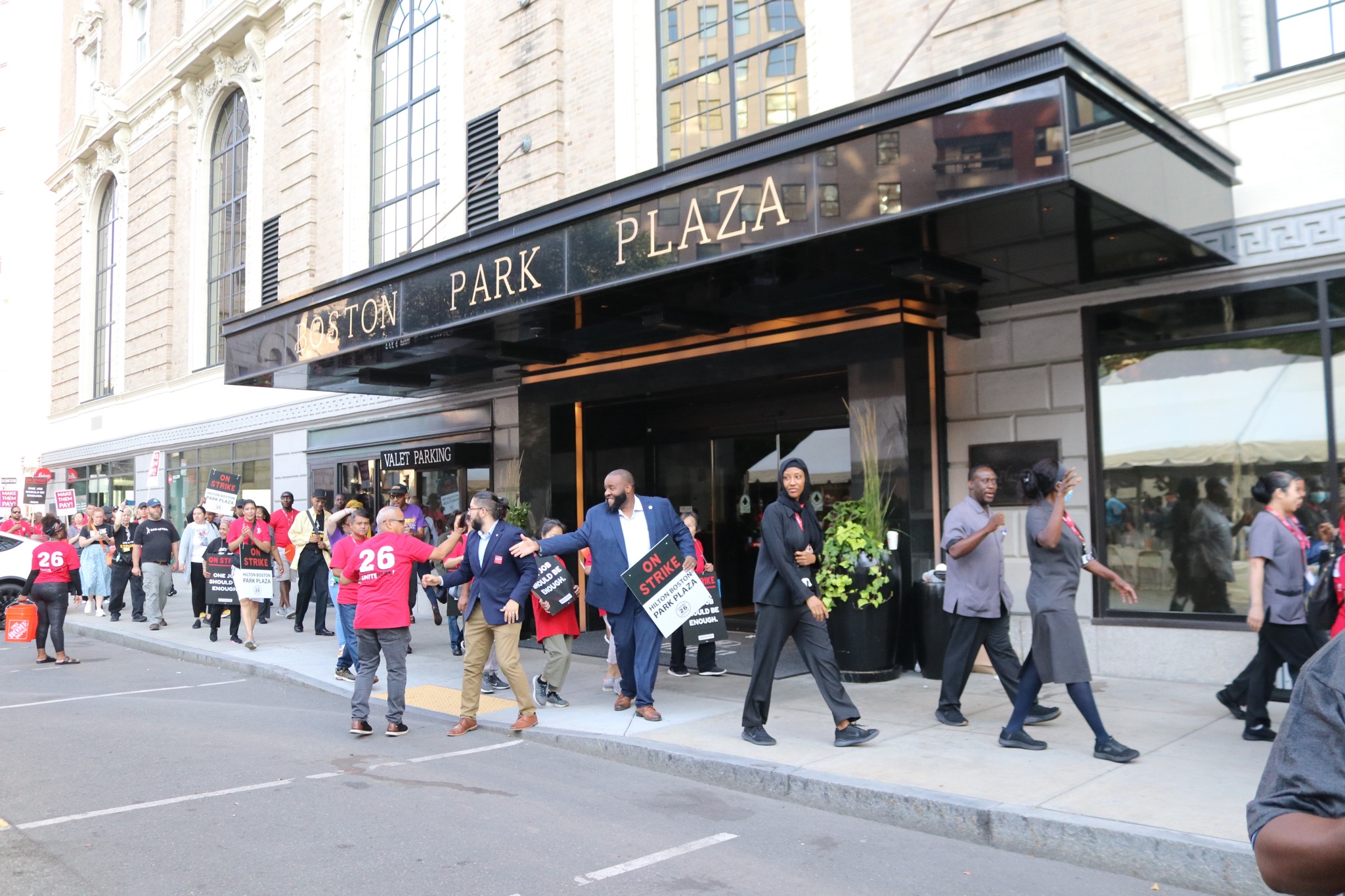 Chris Worrell marching with hotel workers at Boston Park Plaza strike